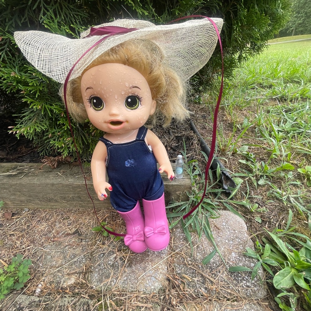 Adorable Doll with Pink Boots and Sun Hat